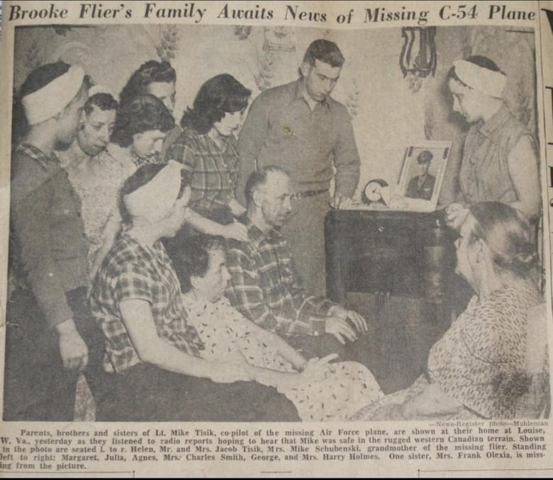 A black and white newspaper clipping shows a family gathered around a radio. The headline reads 'Brooke Flier's Family Awaits News of Missing C-54 Plane.'