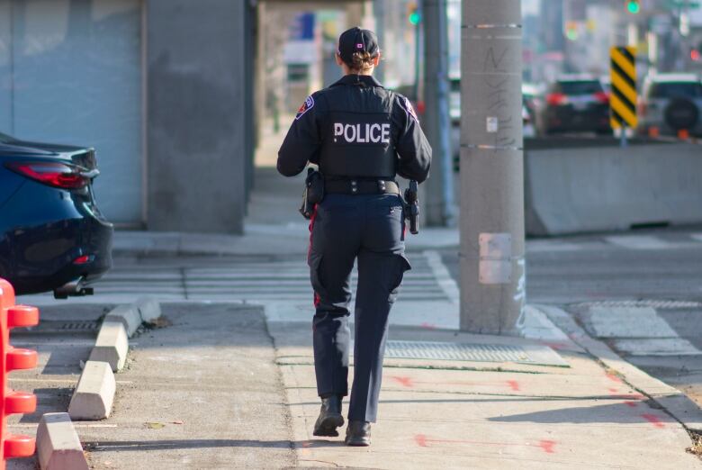 A police officer walking.