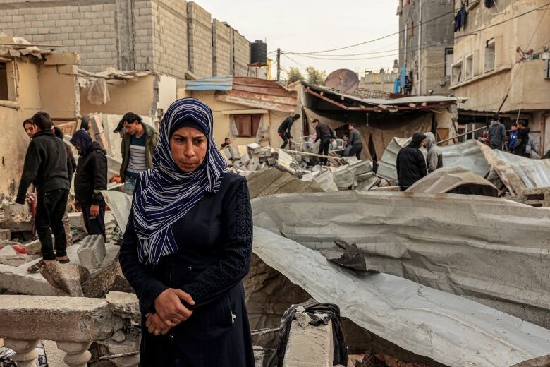 Palestinians check a destroyed house after Israeli airstrikes in Rafah, in the southern Gaza Strip on December 20, 2023.