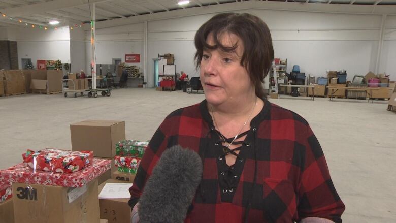 A woman in a red shirt. 