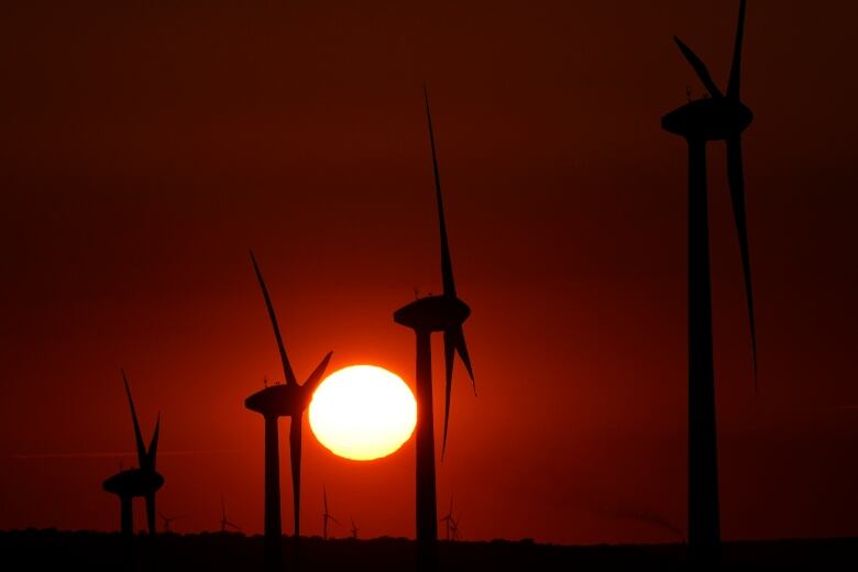 Windmills and a setting sun.