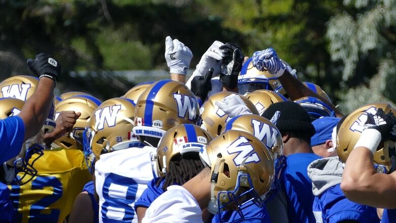 A group of football players are pictured.