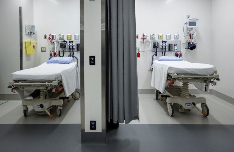 Two beds in a hospital emergency department