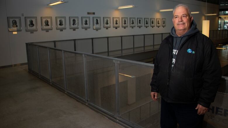 A man stands in a university.