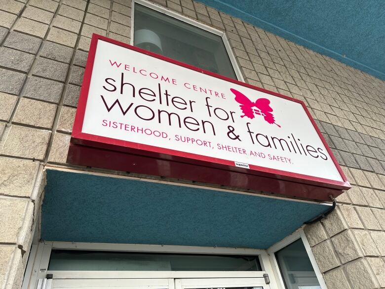 A sign reads Welcome Centre Shelter for Women and Families.