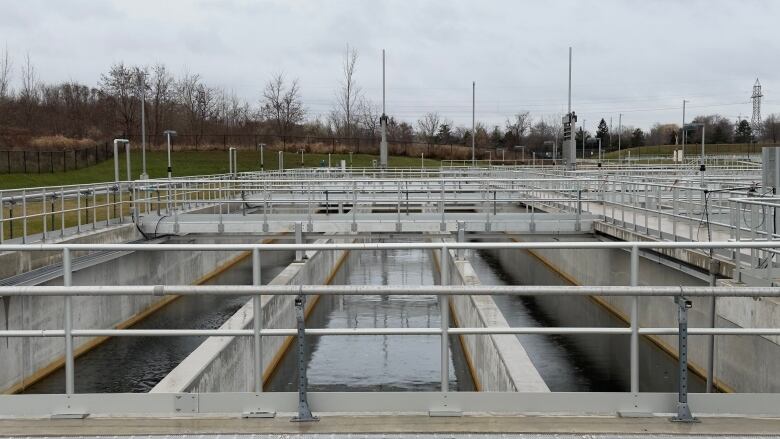 Concrete vats of churning water outdoors