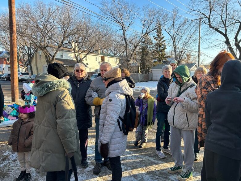 Community volunteers and homeless adocates and supporters met near Carmichael Outreach on Thursday afternoon to join the call for funding for a warming centre. 