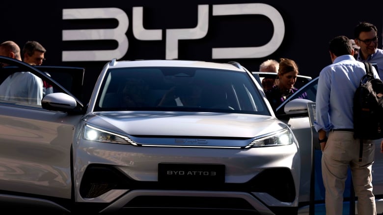 Visitors check the BYD ATTO 3 at the IAA motor show in Munich, Germany, Friday, Sept. 8, 2023. The international motor show IAA Mobility 2023 takes place in Munich from Sept. 5 until Sept. 10, 2023.