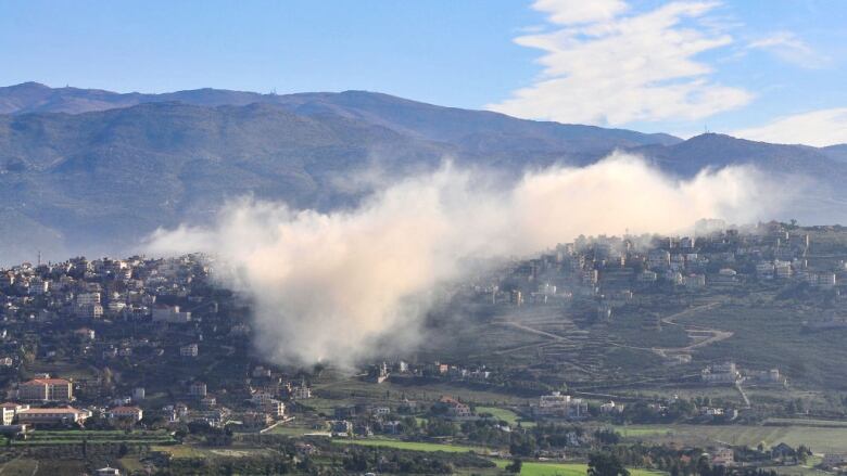 Smoke rises above the southern Lebanese border village of Khiam following Israeli bombardment.