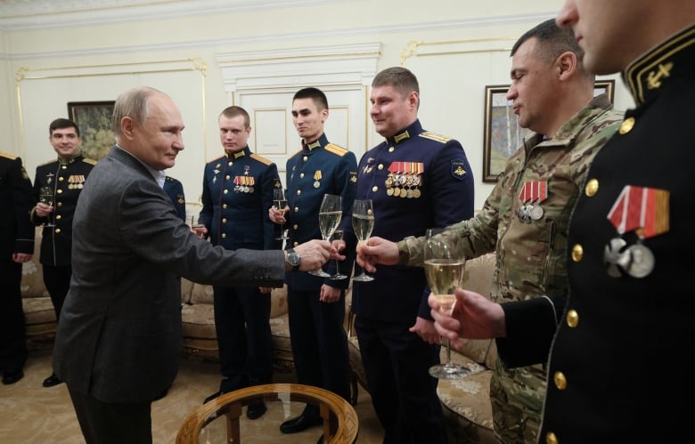 Russia's President Vladimir Putin attends a meeting with service members, involved in the country's war in Ukraine, at the Novo-Ogaryovo state residence outside Moscow, Russia, January 1, 2024. 