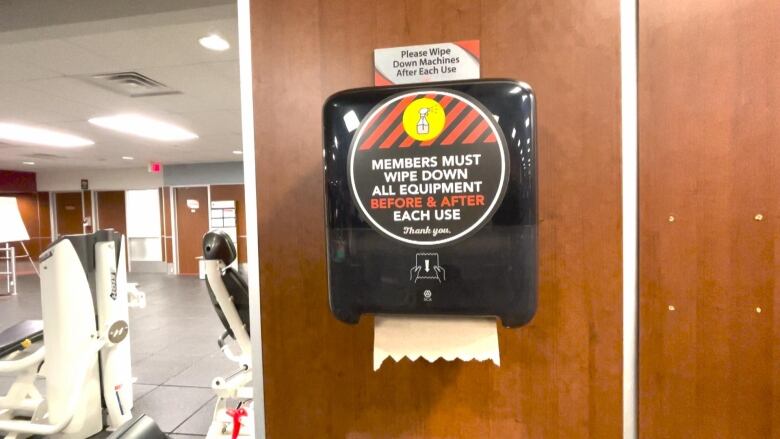 A paper towel dispenser reading 