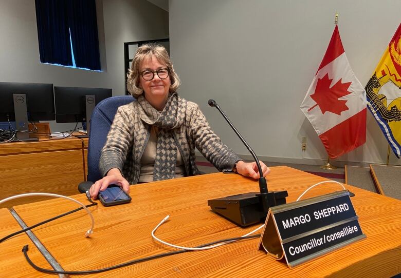 Margo Sheppard sits at in her chair at the Fredericton council table.