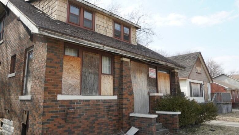 A boarded-up home.