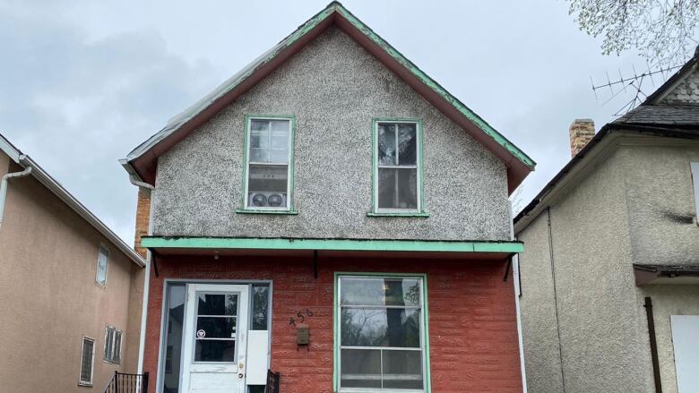 A boarded up vacant home. 