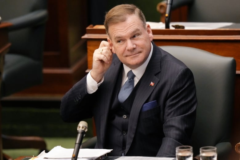 Todd McCarthy seated at Queens Park.