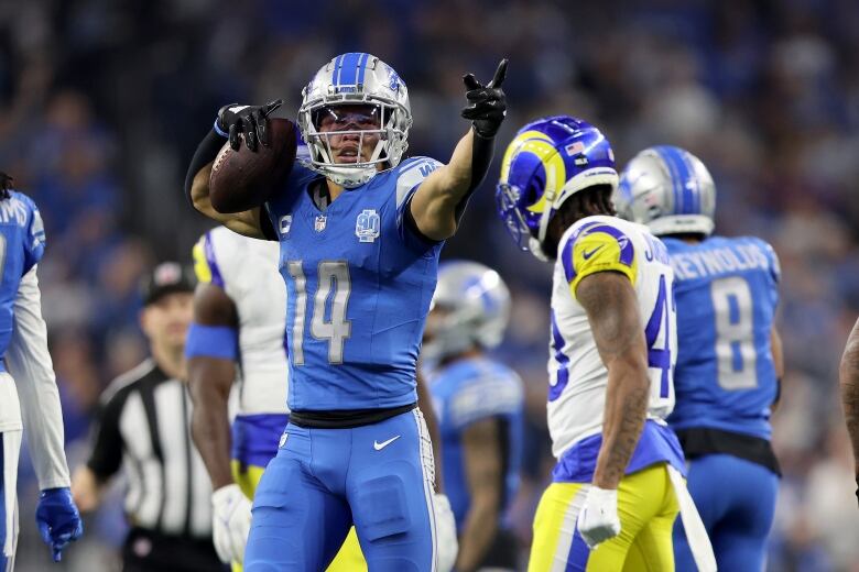 A football player celebrates after securing a first down