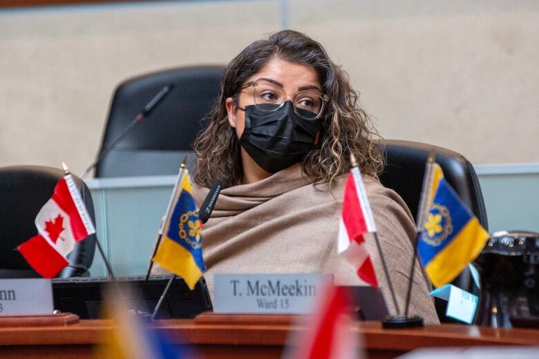 woman sits at council desk