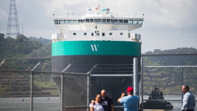 A cargo ship passing through the Panama Canal.