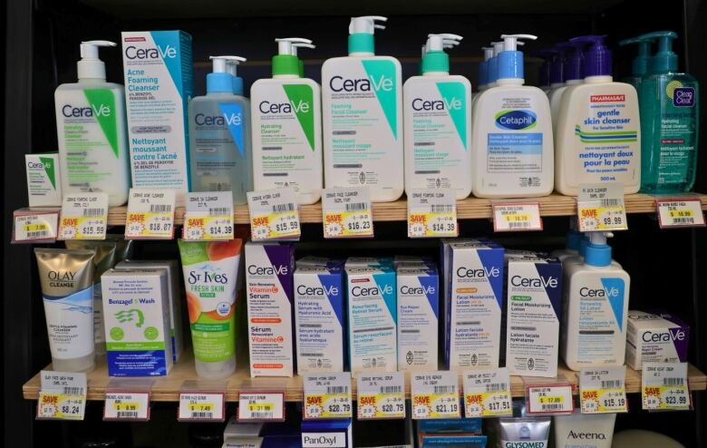 cleansers, sun screen and moisturizer on a pharmacy shelf.