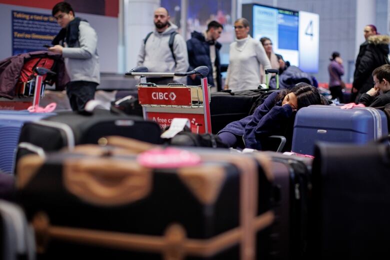 Travellers are pictured at Pearson International Airport, in Toronto, on Dec. 22, 2022  one of the busiest travel days of the holiday season.