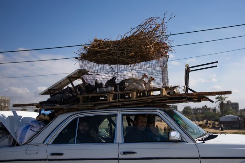 Palestinians are seen arriving in the southern Gaza Strip town of Rafah, after fleeing fighting in nearby Khan Younis.