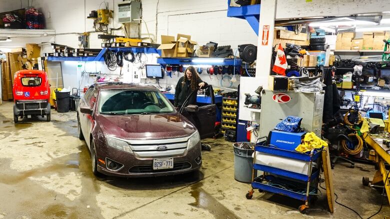 A car getting work done in a garage.