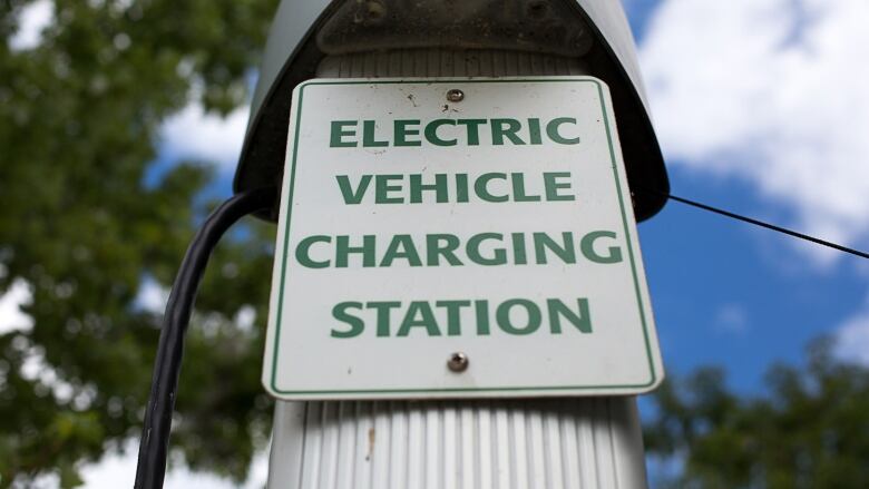 A sign that says 'Electric vehicle charging station'