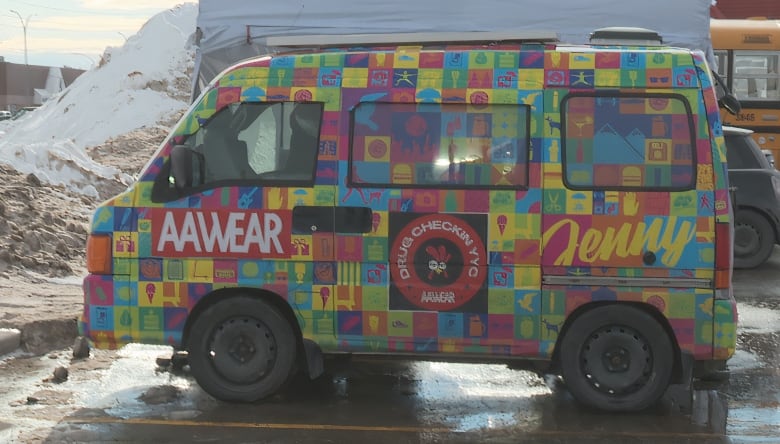 A colorful van with vibrant colors is visible in this photo.