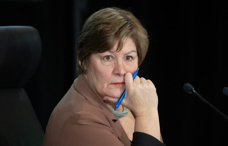 Commissioner Justice Marie-Josee Hogue listens to counsel deliver remarks on the second day of the Public Inquiry Into Foreign Interference in Federal Electoral Processes and Democratic Institutions, Tuesday, Jan.30, 2024 in Ottawa. 