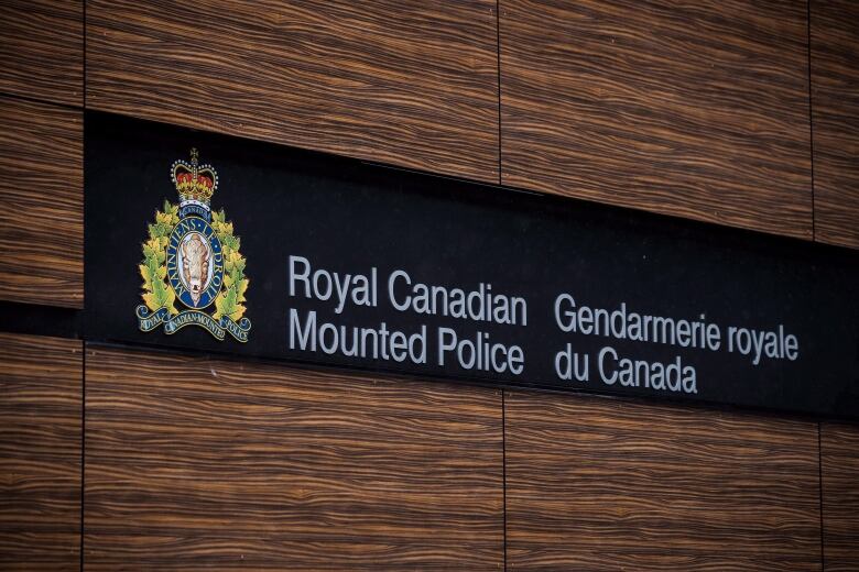 A sign on a wall says Royal Canadian Mountain Police. 