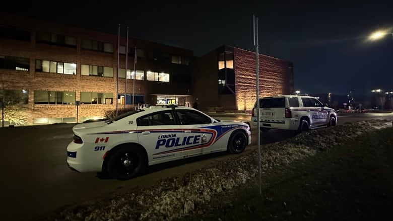 London police cruisers outside the  Thames Valley District School Board office on Jan. 30, 2024. The board decided it will not support a pilot program that would bring back police officers into London-area schools. 