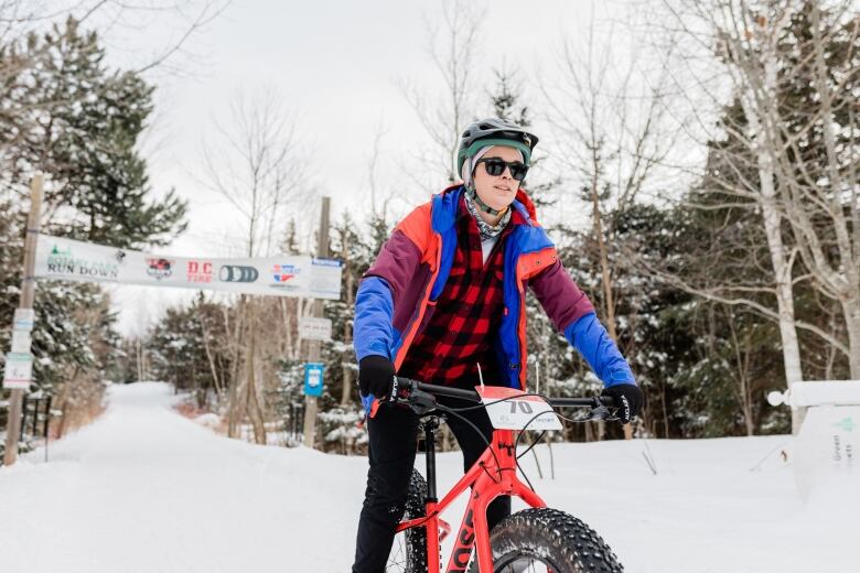 A biker on a snow-covered race course 