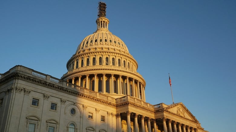 A golden sun over the U.S. Capitol dome  