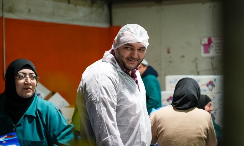 Chief Operating Officer Majd Sinokrot of Sinokrot foods on the production line at his family's business chocolate wafer business in Ramallah.