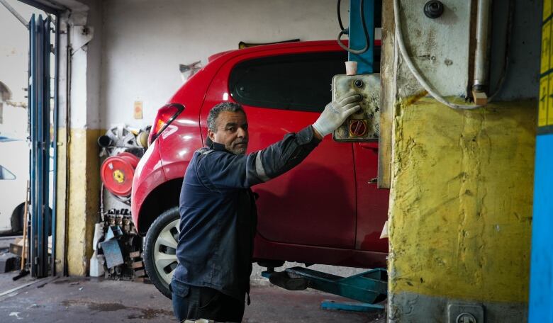 Ramallah mechanic Hisham Jaber says many people still need their cars repaired, but they cannot afford to pay.