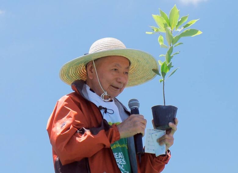 Man holding a plant