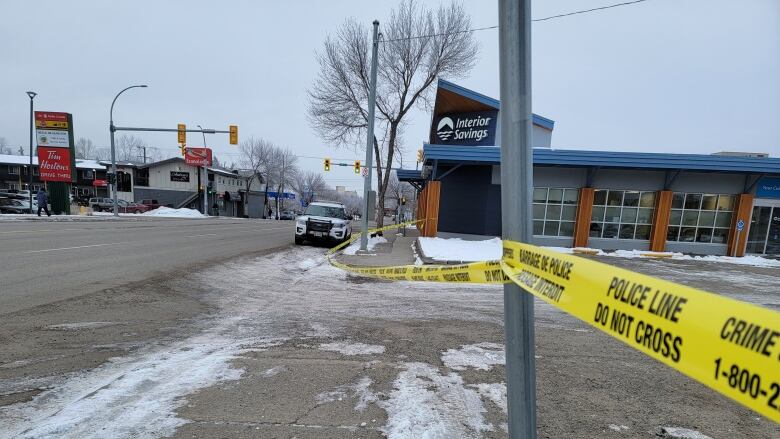 Police tape on a street.