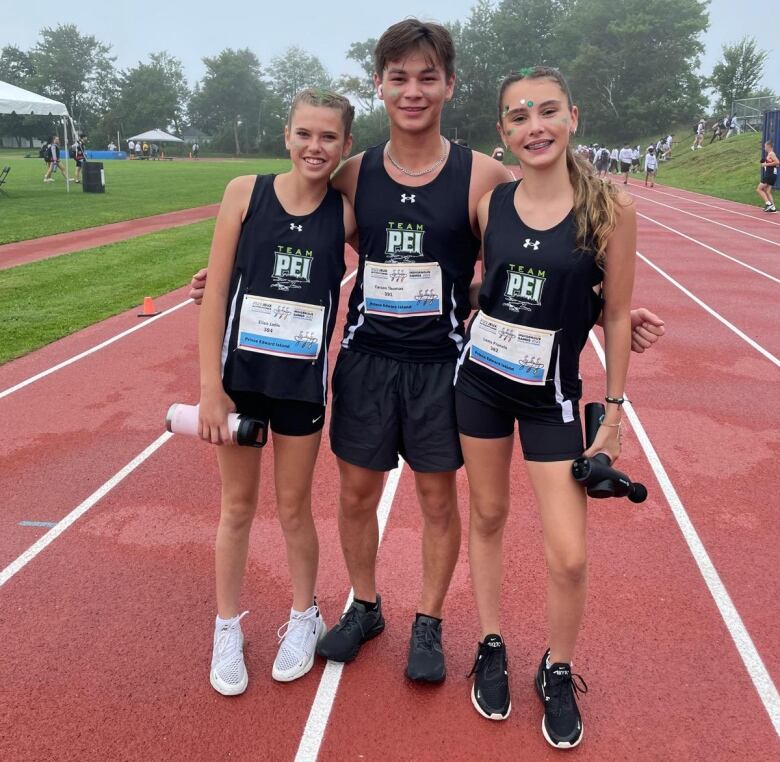 Three young Indigenous athletes in Team PEI uniforms. 