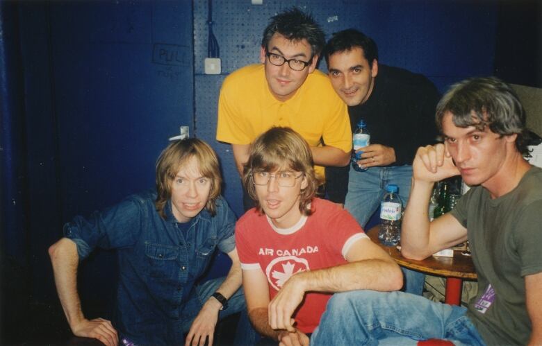 A lawyer and four members of a band are shown in a photo from Spain in 2000.