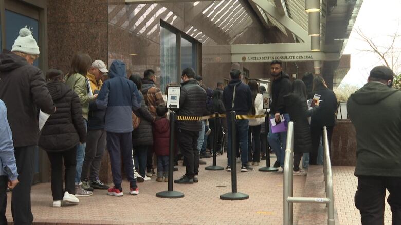 People line up outside the U.S. Consulate General.