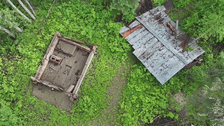 An aerial view of a cabin without a roof