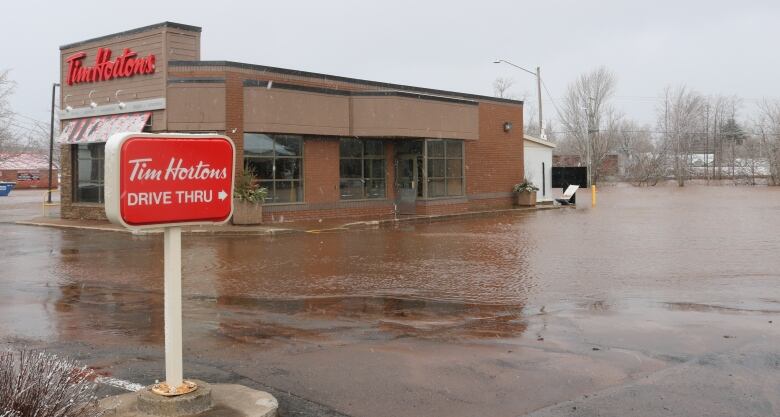 A Tim Hortons with a flooded parking lot