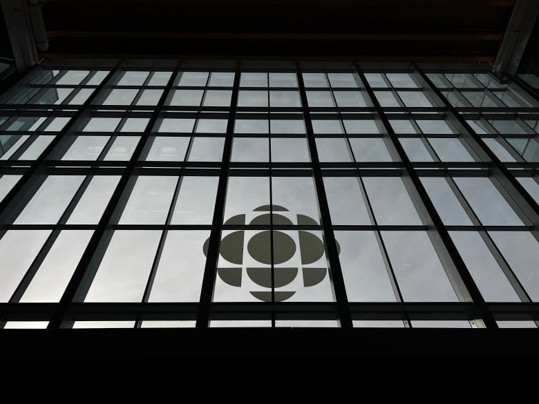 Image of CBC logo on a building, from worm's-eye view.