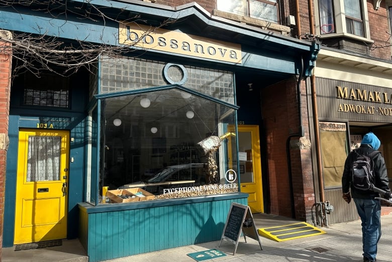 Exterior of bar and bottle shop with sign that says 'bossanova' 