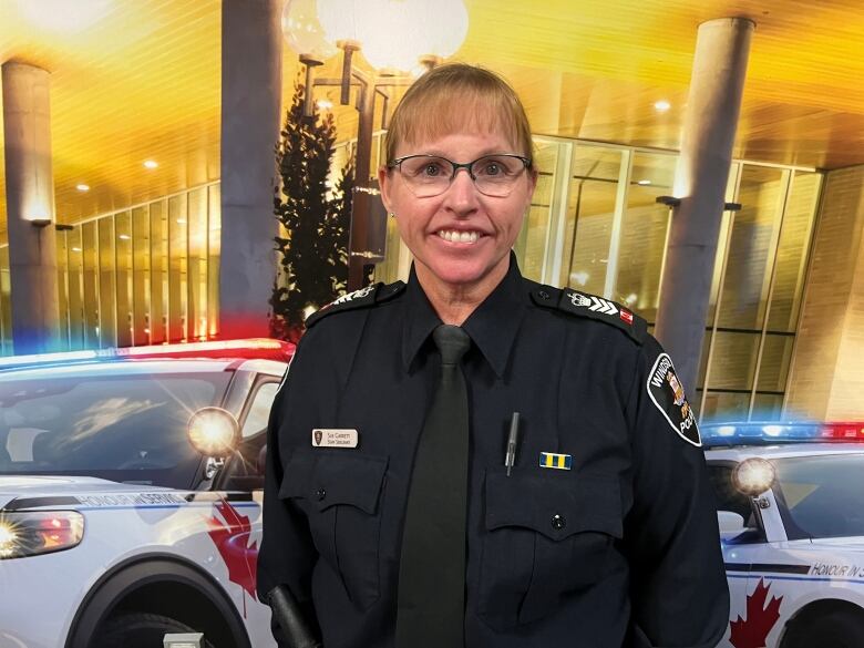 A uniformed police officer.