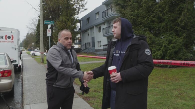 Eugene Tolander shakes Landon Phillips' hand, saying Phillips helped save his life.