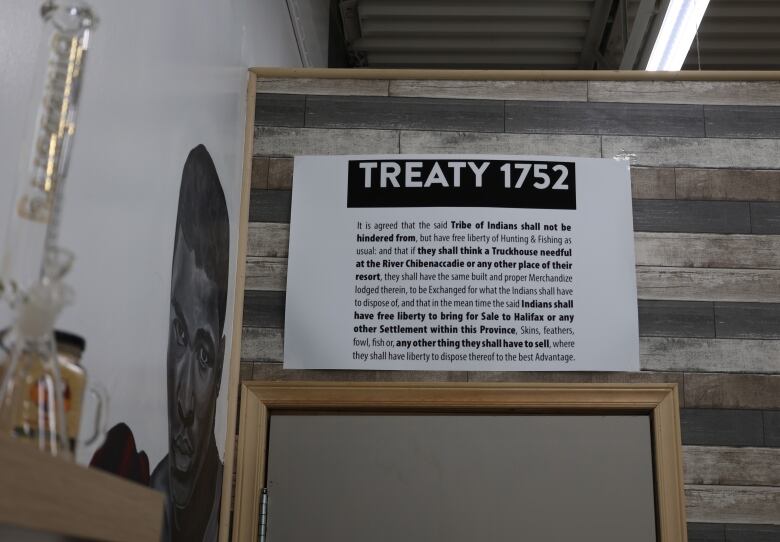 A sign that says Treaty 1752 is shown above a doorway.