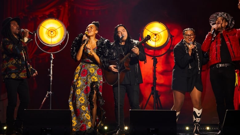 From left to right: Julian Taylor, Allison Russell, Aysanabee, Shawnee Kish and Logan Staats, along with William Prince (not pictured), pay tribute to the late Gordon Lightfoot and Robbie Robertson. 