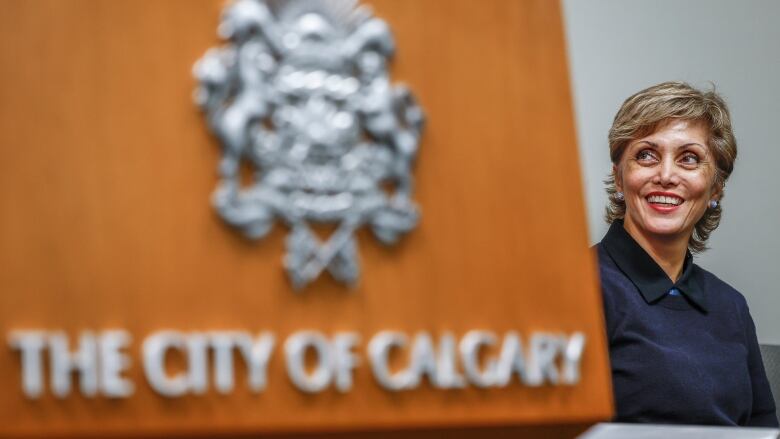 a City of Calgary podium with Mayor Jyoti Gondek 