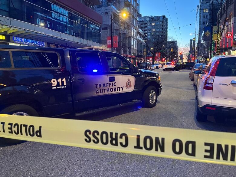 Police tape cordons off a stretch of Robson Street as police investigate.